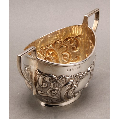 1022 - An Edward VII Rococo Revival silver two-handled sugar basin, chased with flowers and foliate scrolls... 