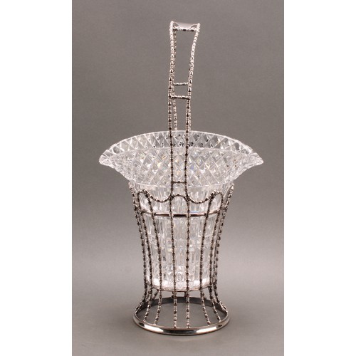 702 - An early 20th century E.P.N.S vase-form flower vase, bead-and-reel borders, hobnail-cut glass liner,... 