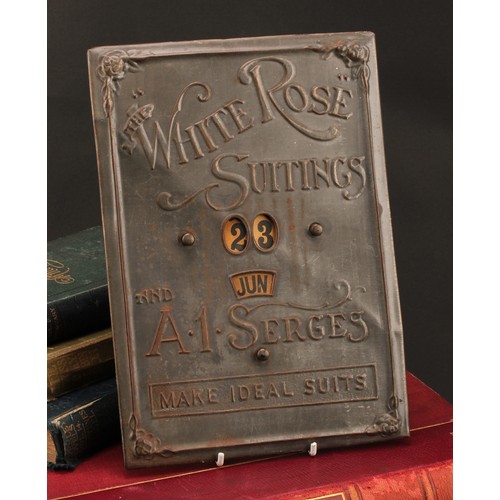 2556 - Advertising - an early 20th century pressed tinplate perpetual calendar, The White Rose  Suitings an... 