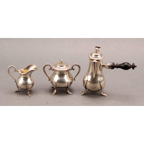 748 - A French silver miniature toy coffee service, comprising side-handled poit, cream jug and sucrier, o... 