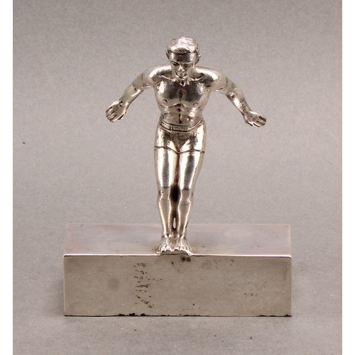 1126 - Sport - Swimming - an early Elizabeth II silver figure, of a swimmer preparing to dive, 11.5cm high,... 