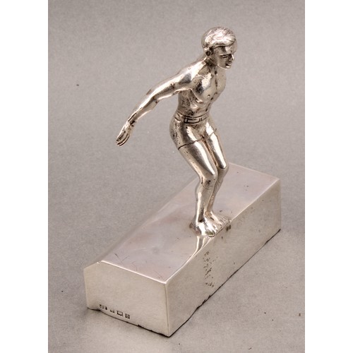 1126 - Sport - Swimming - an early Elizabeth II silver figure, of a swimmer preparing to dive, 11.5cm high,... 