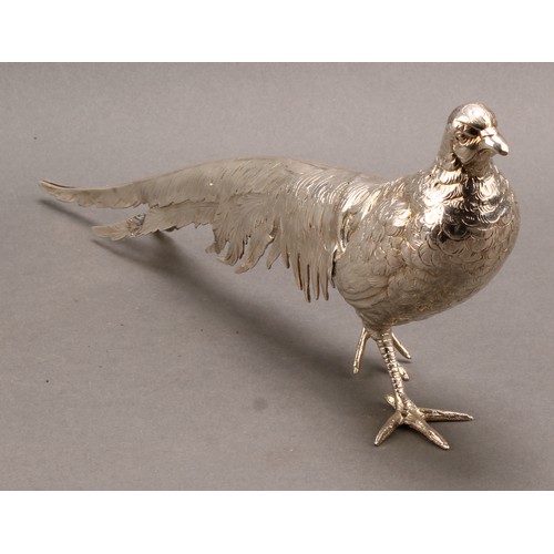 839 - A large Continental silver novelty table decoration, cast as a pheasant, 32cm long, marked Silver, 4... 