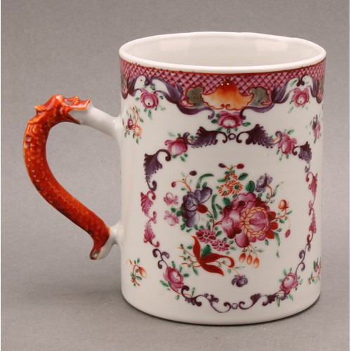 1369 - An 18th century Chinese cylindrical mug, painted in the famille rose palette with flowers, dragon ha... 