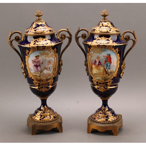 244 - A pair of 19th century Sèvres style ormolu mounted pedestal vases and covers, Louis XV in taste, app... 