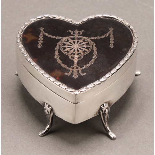1032 - An Edwardian silver love heart shaped jewellery box, the hinged tortoise shell cover inlaid with a g... 