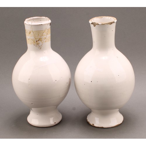 27 - A pair of 18th century Delft drug or pharmacy jars, footed void form with cylindrical collars, paint... 