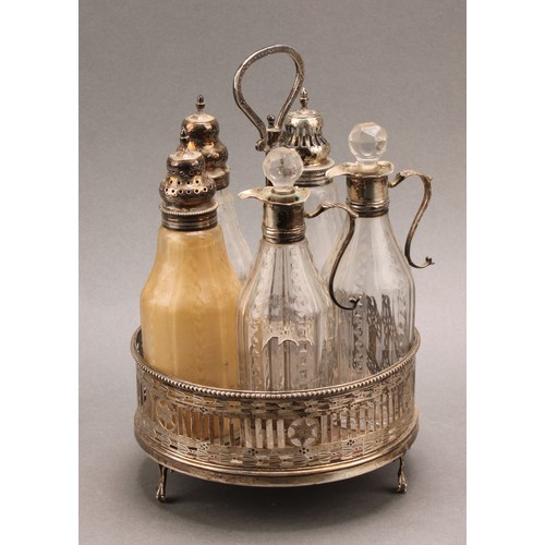 771 - A George III silver circular five bottle cruet, pierced and bright-cut engraved and pierced in the N... 