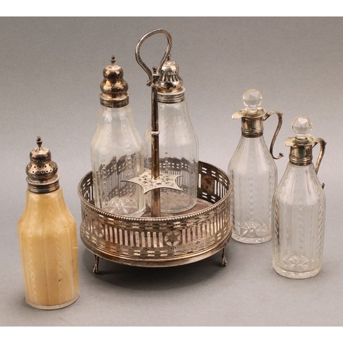 771 - A George III silver circular five bottle cruet, pierced and bright-cut engraved and pierced in the N... 