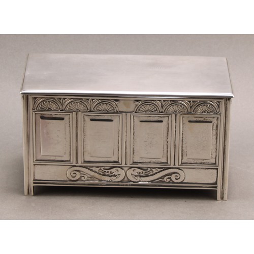 814 - A George V silver novelty cigarette box, as a Charles II blanket chest, hinged cover, oak-lined twin... 