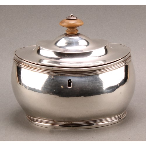 781 - A George III silver oval tea caddy, quite plain, hinged domed cover with fruitwood finial, reeded bo... 