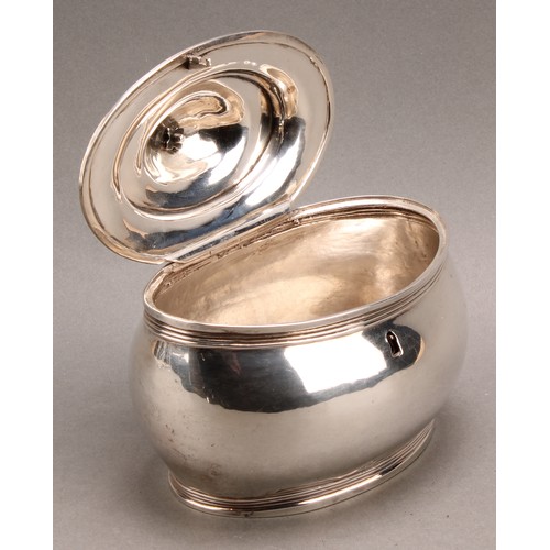 781 - A George III silver oval tea caddy, quite plain, hinged domed cover with fruitwood finial, reeded bo... 