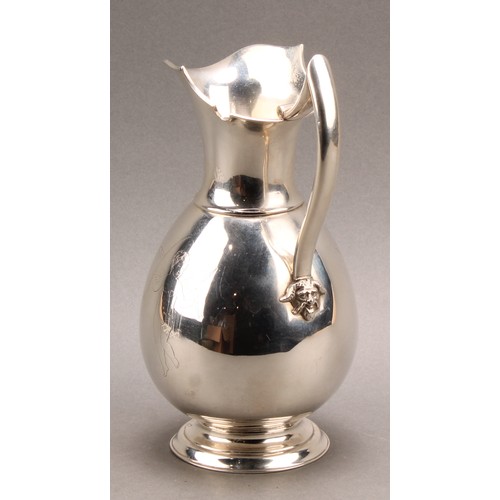 741 - A Danish silver ovoid wine jug, engraved Cupid, angular scroll handle terminating in a Bacchic mask,... 