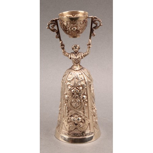 739 - A Continental silver wager cup, of typical Renaissance figural design, chased with flowers and strap... 