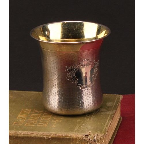 746 - A French silver bell shaped beaker, engine turned, gilt interior, 7cm high, 19th century, 96g