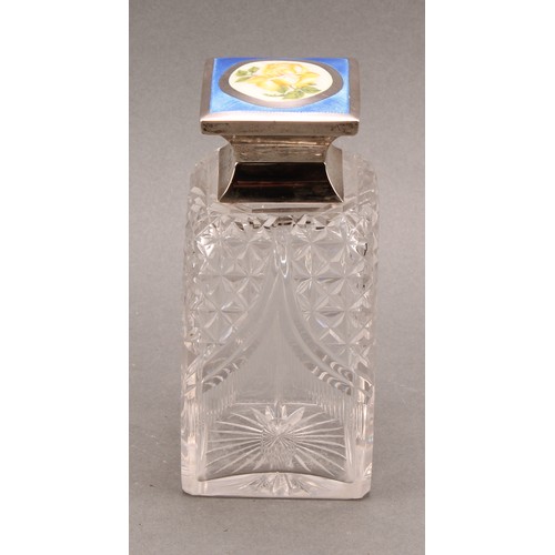 806 - A George V silver and enamel mounted square scent bottle, hinged cover decorated with a yellow rose ... 