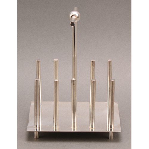 677 - A Modernist E.P.N.S toast rack, of Christopher Dresser inspiration, posted T-bar handle, 13cm long, ... 