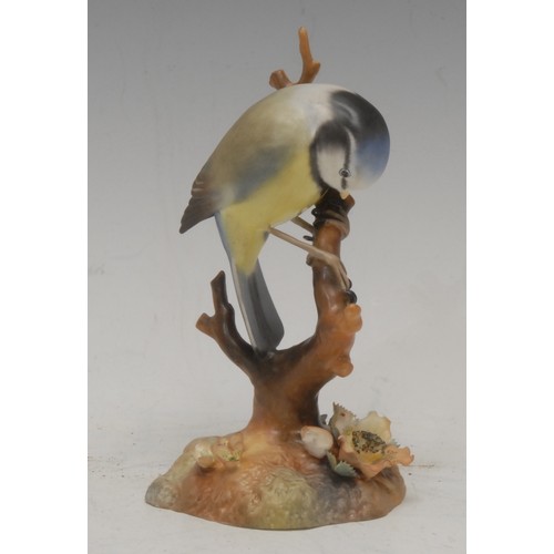 201 - A Royal Crown Derby porcelain model, of a Long Tailed Tit, painted in polychrome, 14cm high, printed... 