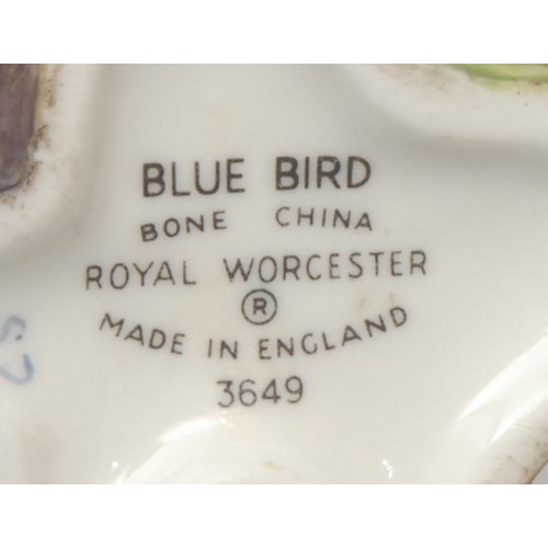 201 - A Royal Crown Derby porcelain model, of a Long Tailed Tit, painted in polychrome, 14cm high, printed... 