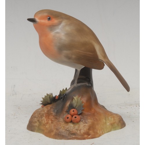 201 - A Royal Crown Derby porcelain model, of a Long Tailed Tit, painted in polychrome, 14cm high, printed... 