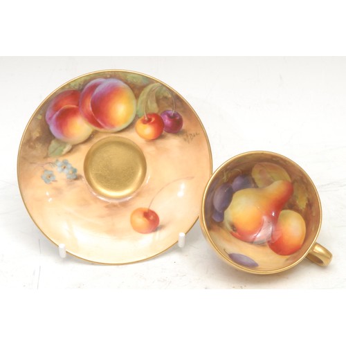 143 - A Royal Worcester cabinet cup and saucer, painted by W. Bee, signed, with ripening fruit on a mossy ... 