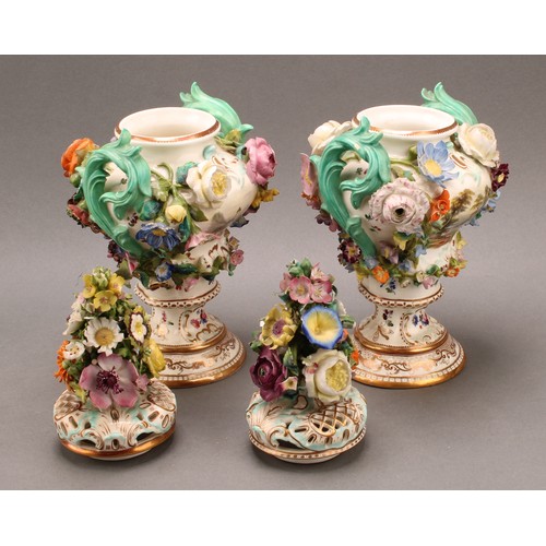 92 - A pair of Coalbrookdale Rococo Revival porcelain pot pourri pedestal vases, painted with flowers and... 