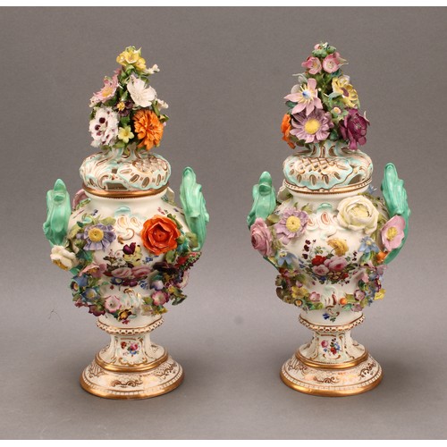 92 - A pair of Coalbrookdale Rococo Revival porcelain pot pourri pedestal vases, painted with flowers and... 