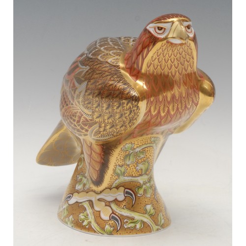 206 - A Royal Crown Derby paperweight, Golden Eagle, a limited edition Prestige model, designed by Tien Ma... 