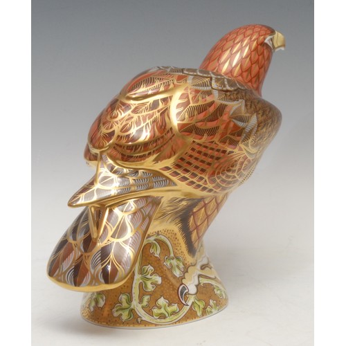 206 - A Royal Crown Derby paperweight, Golden Eagle, a limited edition Prestige model, designed by Tien Ma... 