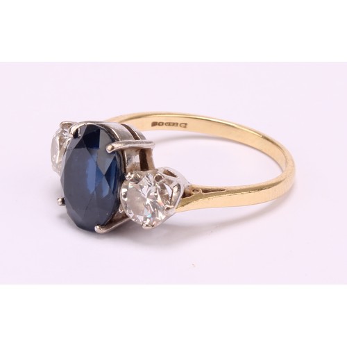 1173 - 18ct yellow gold Sapphire and Diamond Trilogy Ring
The ring is set with an approx. 4.59ct oval brill... 