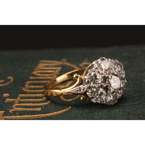 1264 - Tested 18ct gold seven stone Diamond cluster ring
The ring has a centre round brilliant cut diamond ... 