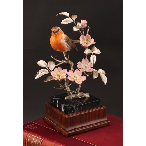 1050 - An Elizabeth II silver and porcelain model, of a Robin perched on the branch of a Dog Rose, silver n... 