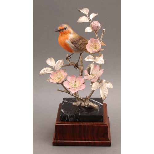 1050 - An Elizabeth II silver and porcelain model, of a Robin perched on the branch of a Dog Rose, silver n... 