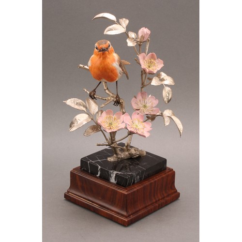 1050 - An Elizabeth II silver and porcelain model, of a Robin perched on the branch of a Dog Rose, silver n... 