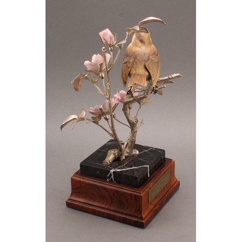 1050 - An Elizabeth II silver and porcelain model, of a Robin perched on the branch of a Dog Rose, silver n... 