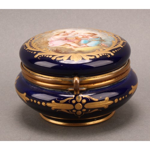 269 - A 'Sevres' porcelain circular dressing table box, the hinged cover painted with two children releasi... 