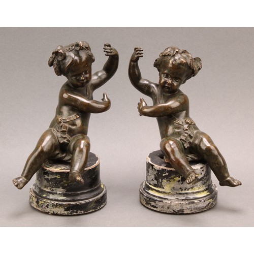 2403 - After Claude Michel Clodion (1738-1814), a pair of dark patinated bronze putti allegorical adornment... 