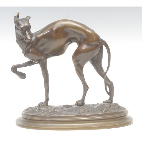 2088 - An early 20th century bronze, of a greyhound in full aspect, stepped oval base, 19cm high, 19cm long