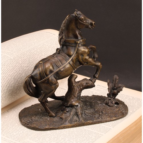 2079 - A 19th century Continental bronze, of a bolting stallion rampant, the base cast with flora, 18cm hig... 