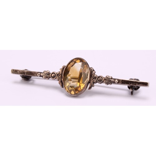 1266 - Two brooches, to include; a 9ct gold Amethyst and Seed Pearl brooch with safety chain and a sterling... 