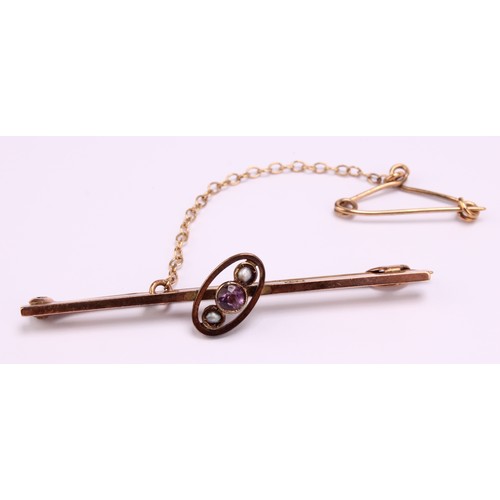 1266 - Two brooches, to include; a 9ct gold Amethyst and Seed Pearl brooch with safety chain and a sterling... 