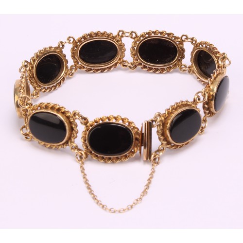 1272 - Vintage 9ct gold cabochon black onyx bracelet with safety chain, the bracelet consists of eight piec... 