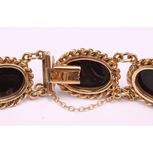 1272 - Vintage 9ct gold cabochon black onyx bracelet with safety chain, the bracelet consists of eight piec... 