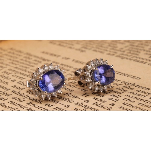 1171 - 18ct white gold Tanzanite and Diamond earrings, each earring contains an approx. 1.00ct (1 carat) ov... 