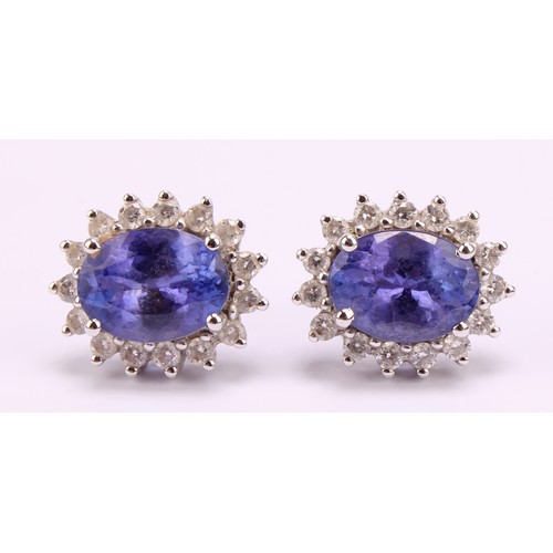 1171 - 18ct white gold Tanzanite and Diamond earrings, each earring contains an approx. 1.00ct (1 carat) ov... 