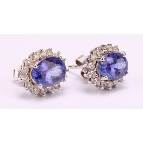 1171 - 18ct white gold Tanzanite and Diamond earrings, each earring contains an approx. 1.00ct (1 carat) ov... 