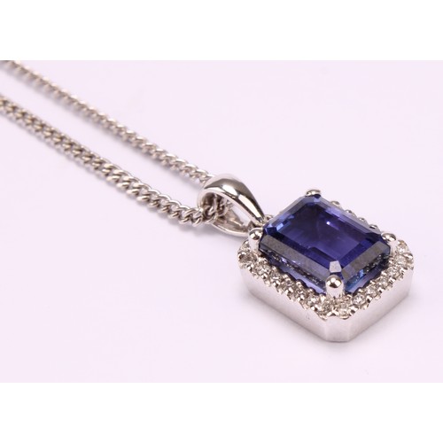 1172 - 18ct white gold Tanzanite and Diamond pendant necklace, the pendant set with an emerald cut approx. ... 