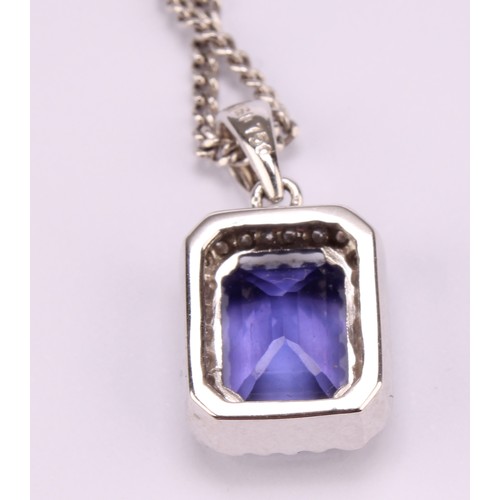 1172 - 18ct white gold Tanzanite and Diamond pendant necklace, the pendant set with an emerald cut approx. ... 