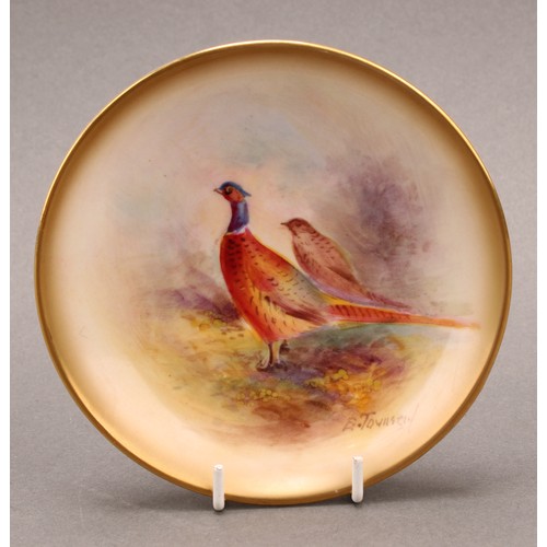 145 - A Royal Worcester circular trinket dish, painted by E. Townsend, with a brace of pheasants in a wood... 