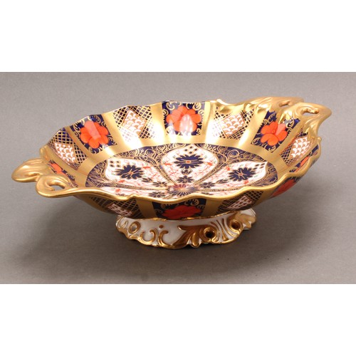 192 - A Royal Crown Derby 1128 Imari pattern Duchess pedestal dish, solid gold band, leafy scroll handles,... 